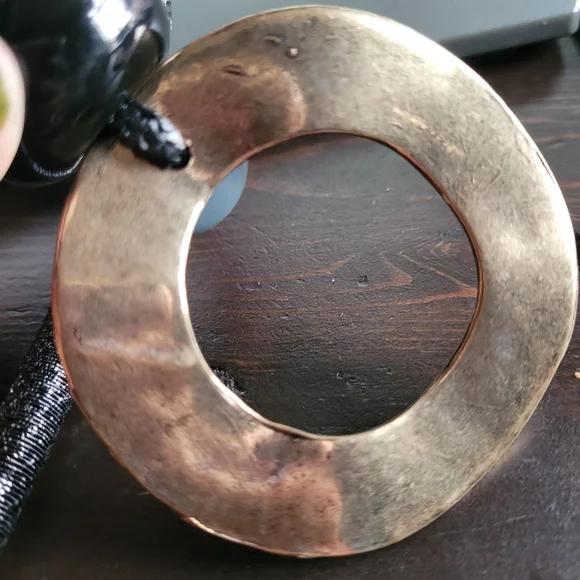 Black rope necklace with gold medal, black, and gray circle. - Picture 4 of 6